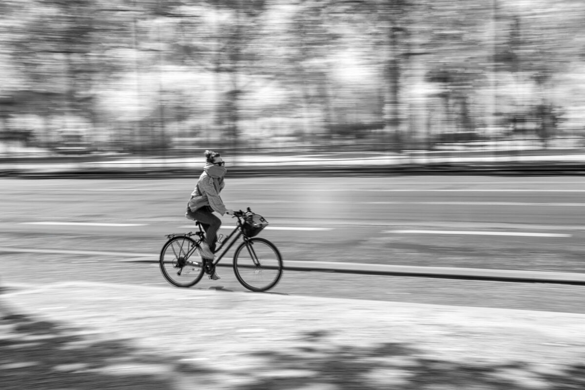 Through the use of panning, the photographer was able to freeze the motion of the cyclist while blurring out the background.
